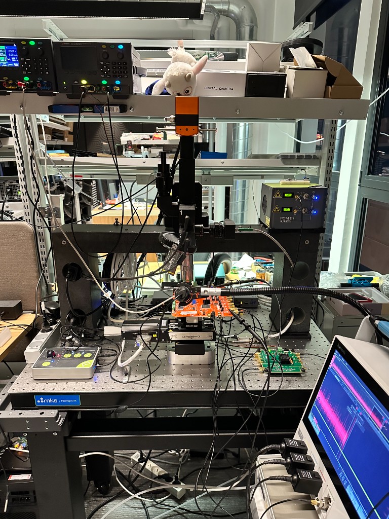 Laser fault injection bench with the Tangem card mounted under the objective.